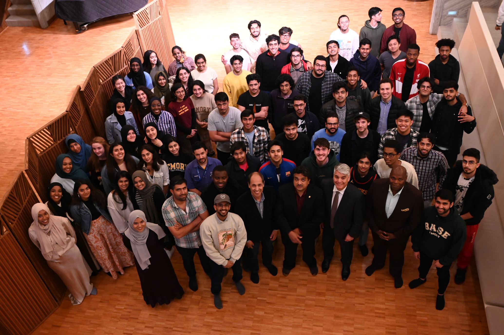 large group of emory muslim alumni posing for a service award picture